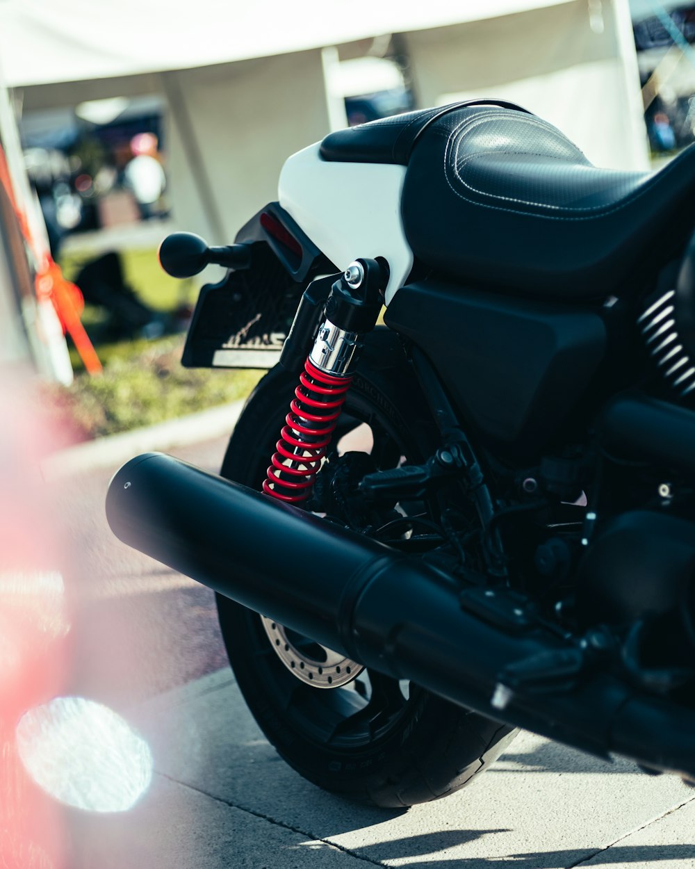 a black motorcycle with a red light