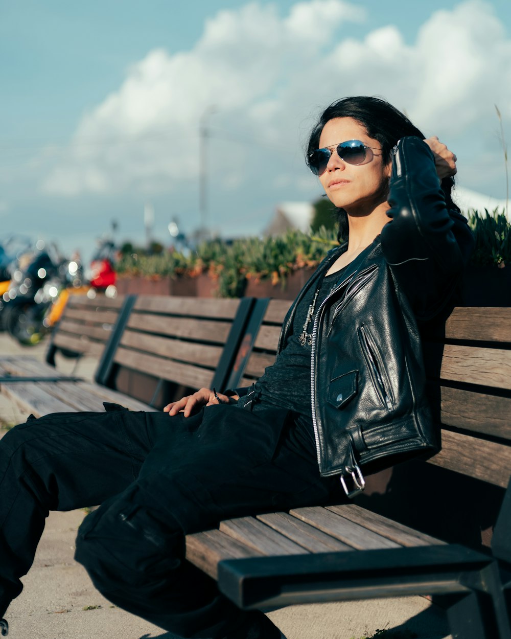 a woman sitting on a bench