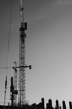 Image showing civil construction workers operating cranes.