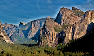 A serene granite landscape under a vast blue sky, symbolizing resilience and the enduring spirit of life.