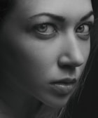 A close-up of a black and white portrait capturing intense emotion and fine details.