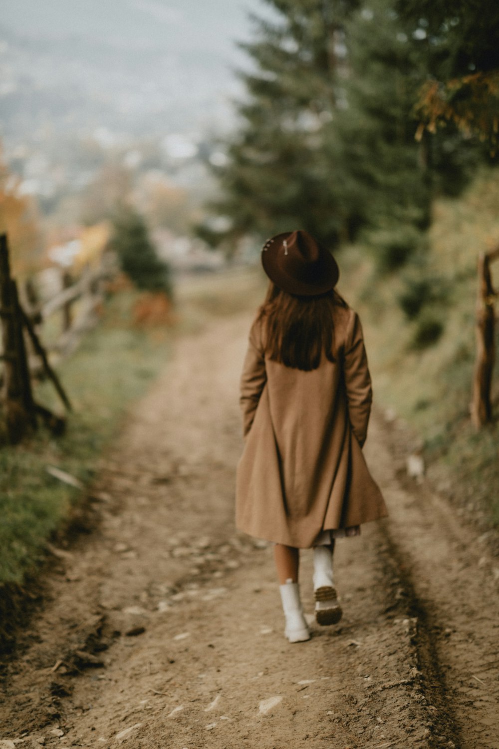 a person walking on a dirt road