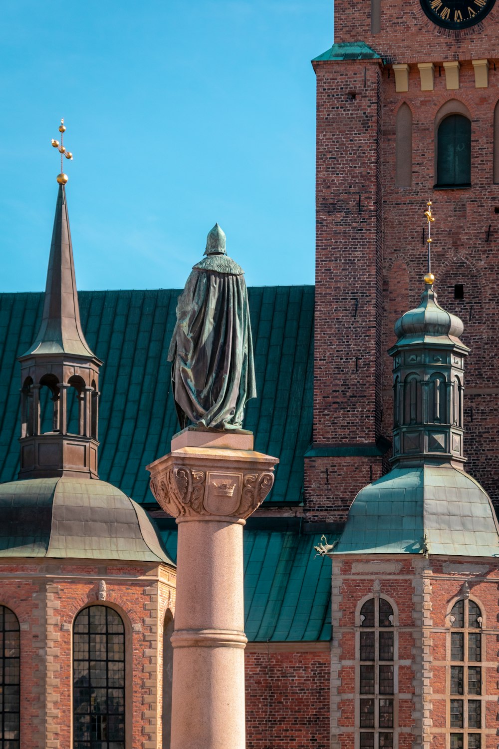 a clock tower next to a brick building