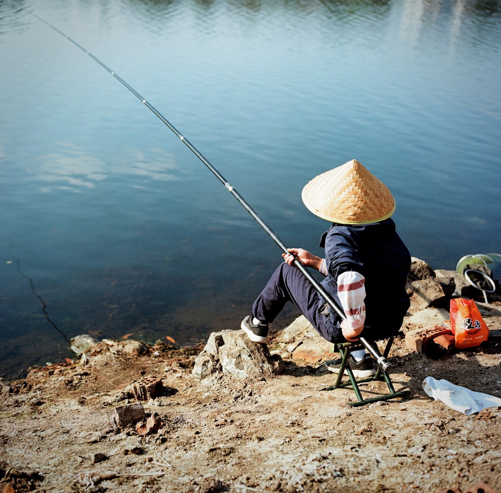 a person sitting on a chair fishing