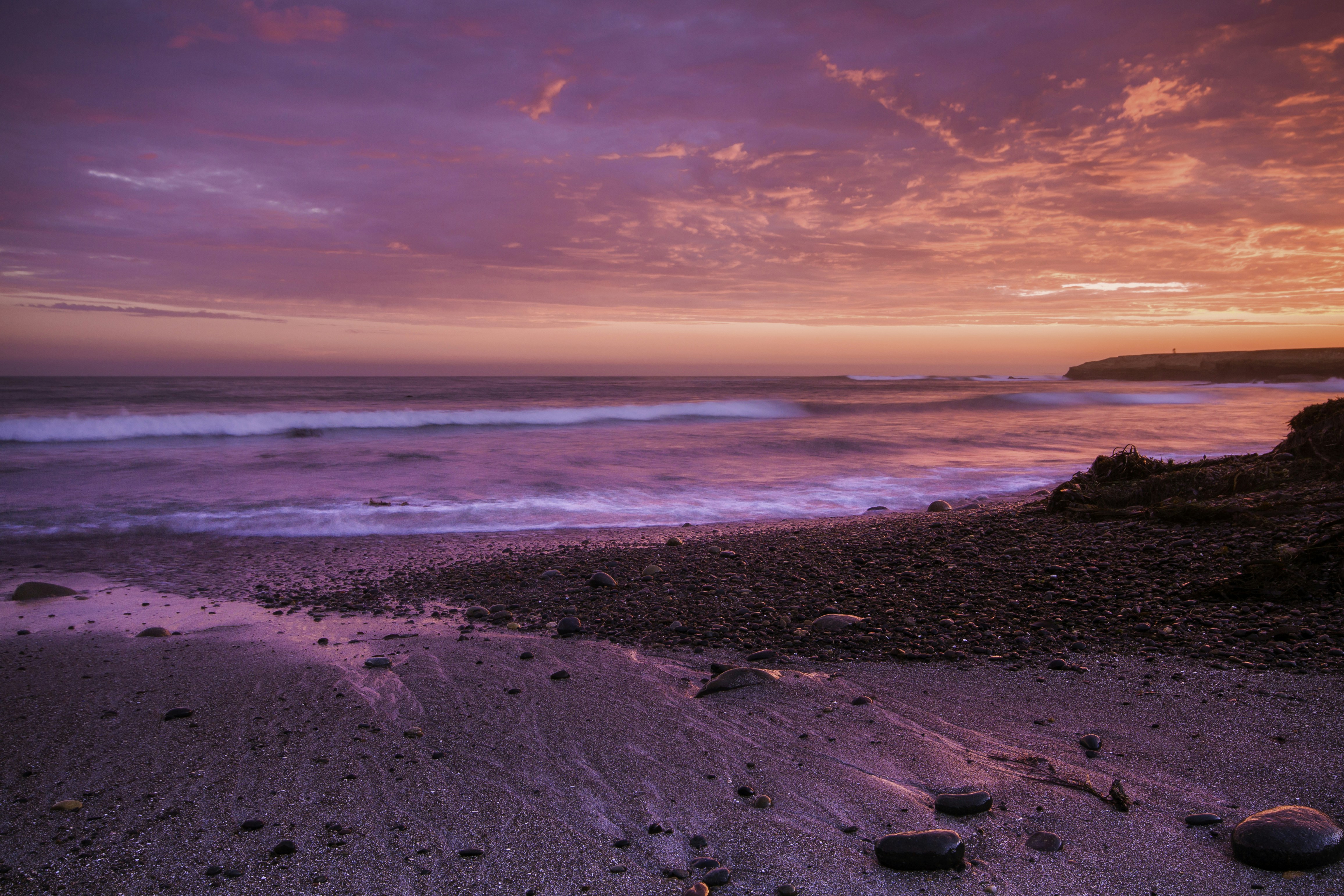 a beach with a sunset
