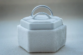 A suede-covered necklace box with a soft-touch finish and magnetic closure.