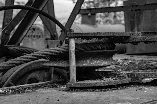 Close-up of mechanical gears and pulleys in lifting equipment.
