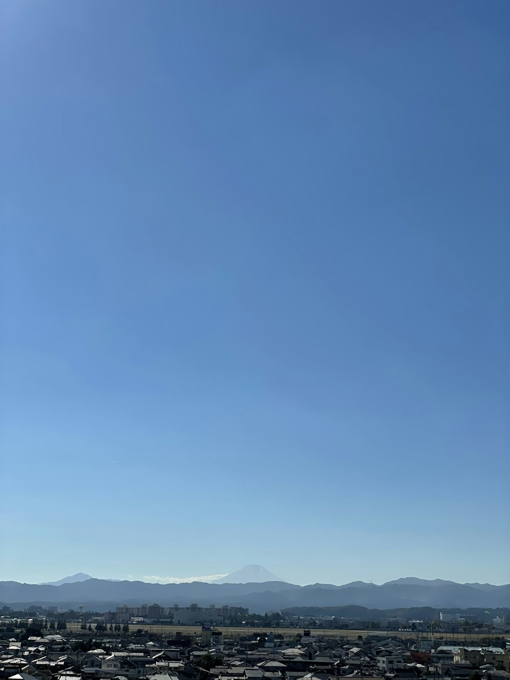 a large parking lot with a mountain in the background