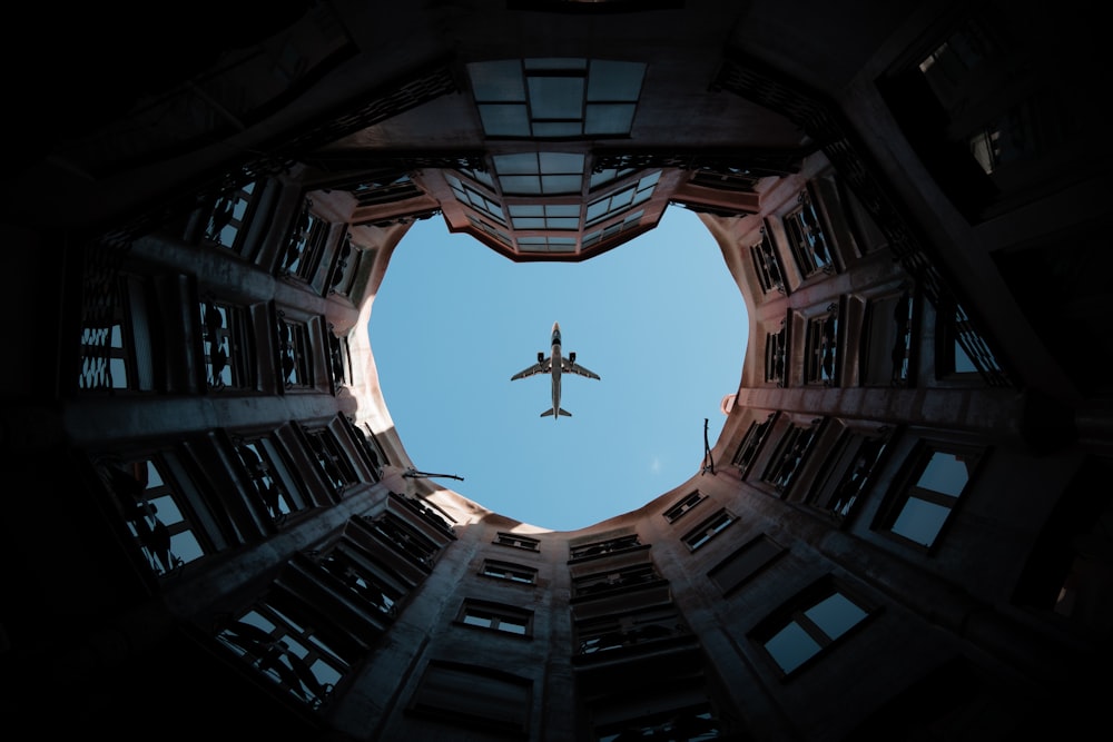 a plane flying over a building