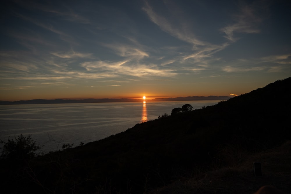 a sunset over a body of water