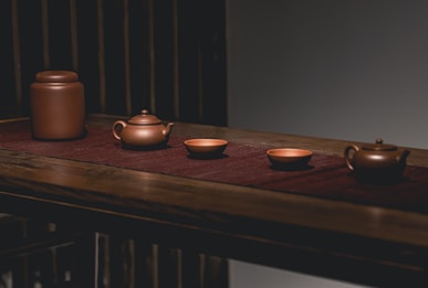 a shelf with pots and pans on it