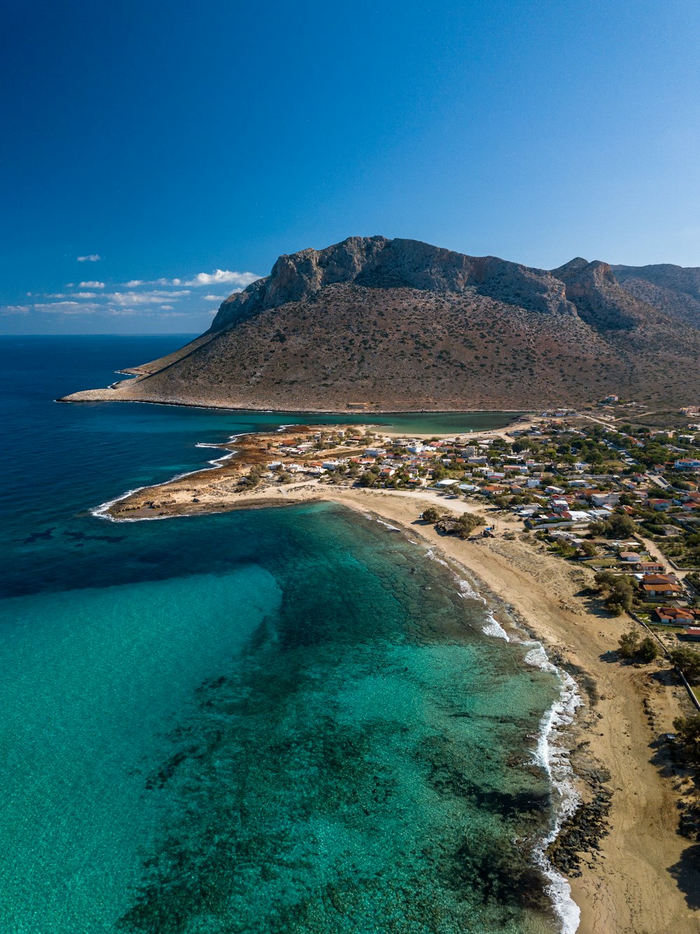 a beach with a mountain in the background