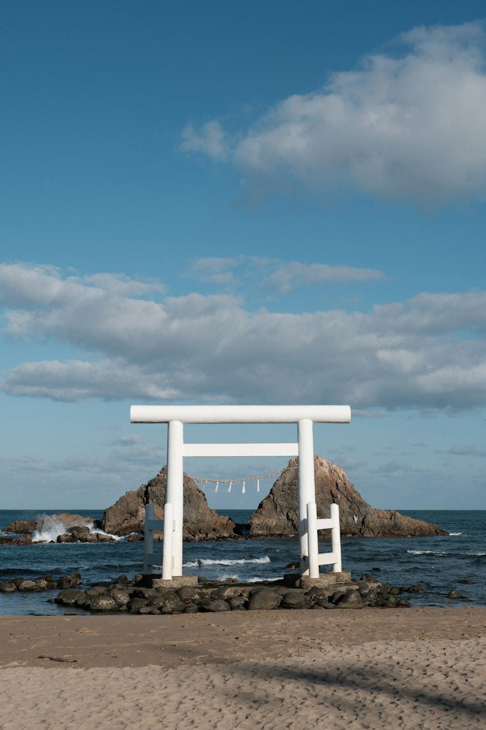 a white structure on a beach