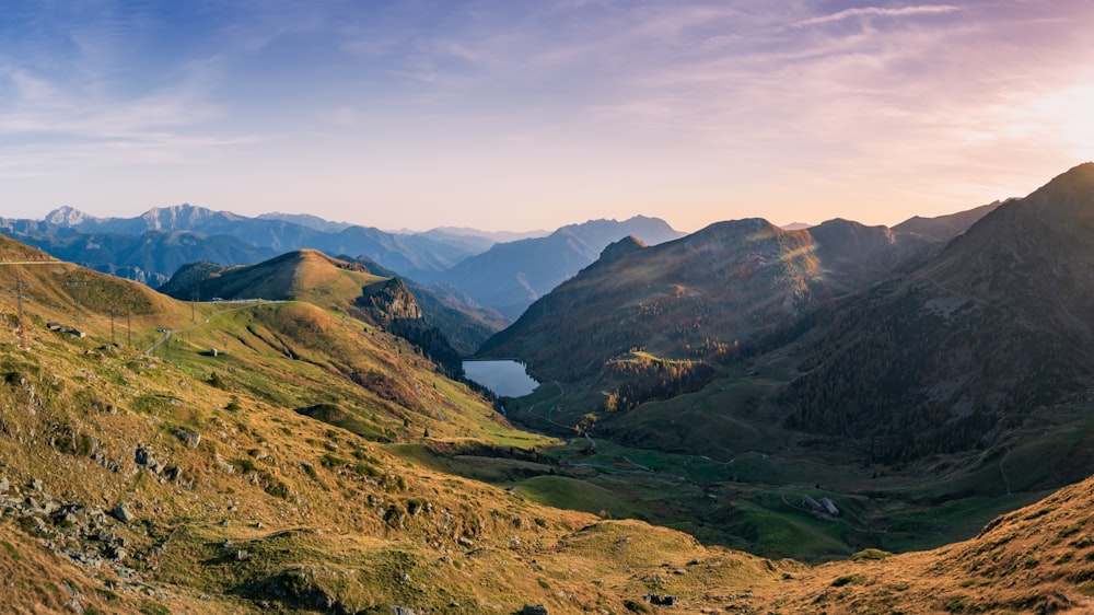 a valley with mountains in the background