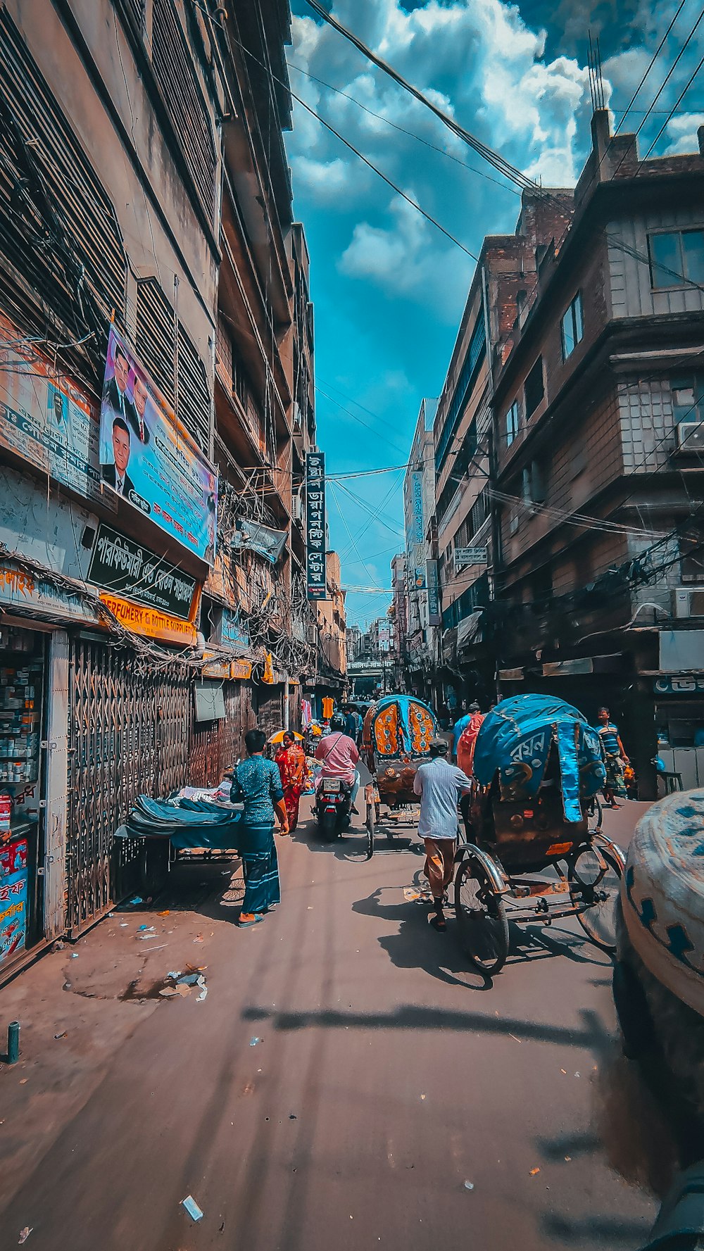 a busy street with people and shops