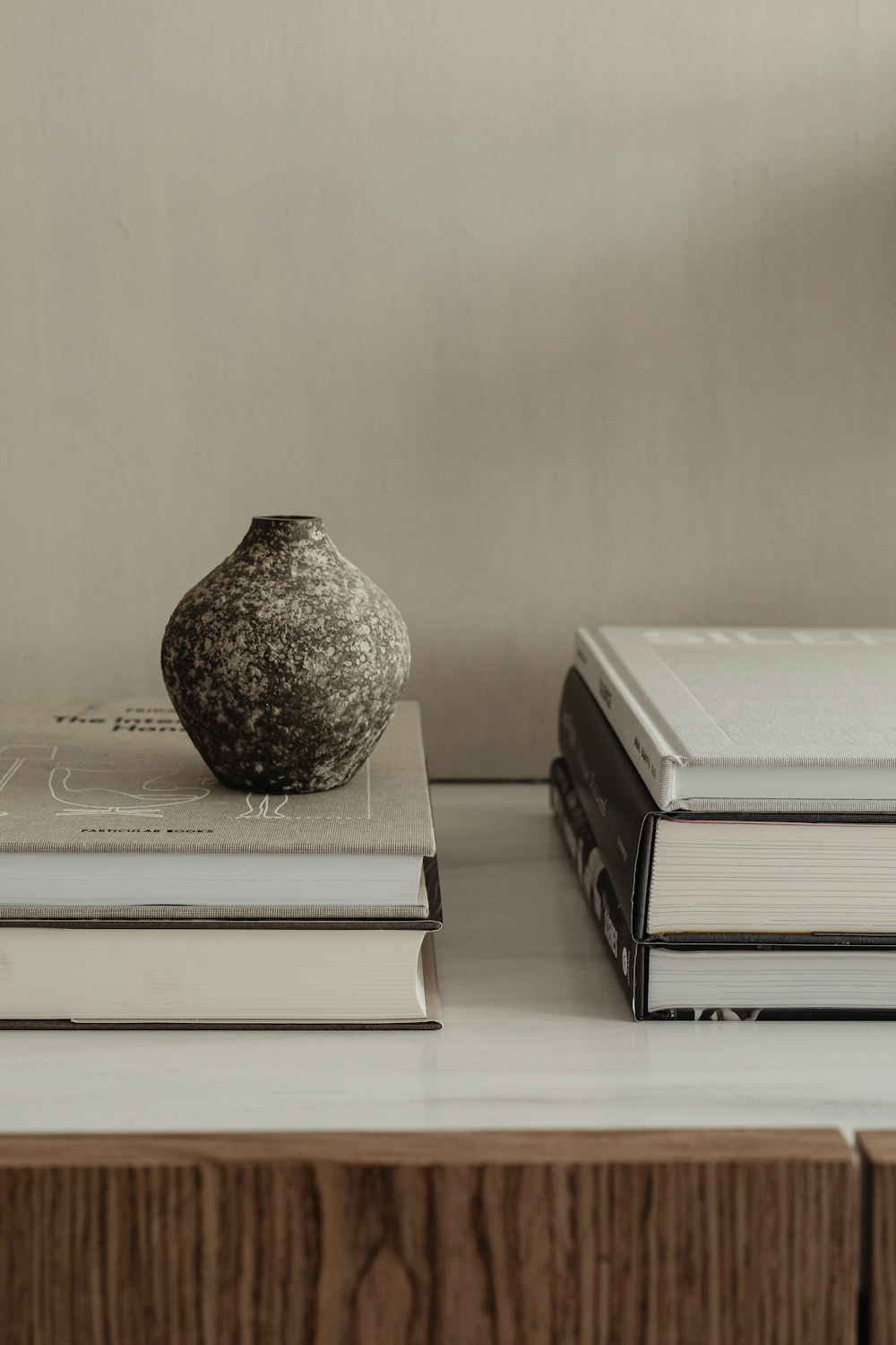 a vase and some books