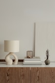 a lamp and books on a table