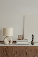 a lamp and books on a table