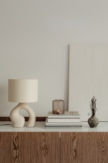 a lamp and books on a table