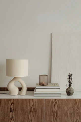 a lamp and books on a table