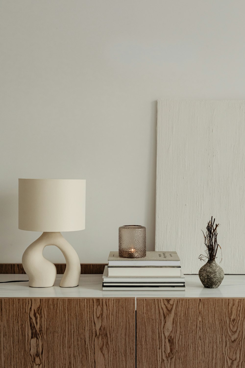 a lamp and books on a table