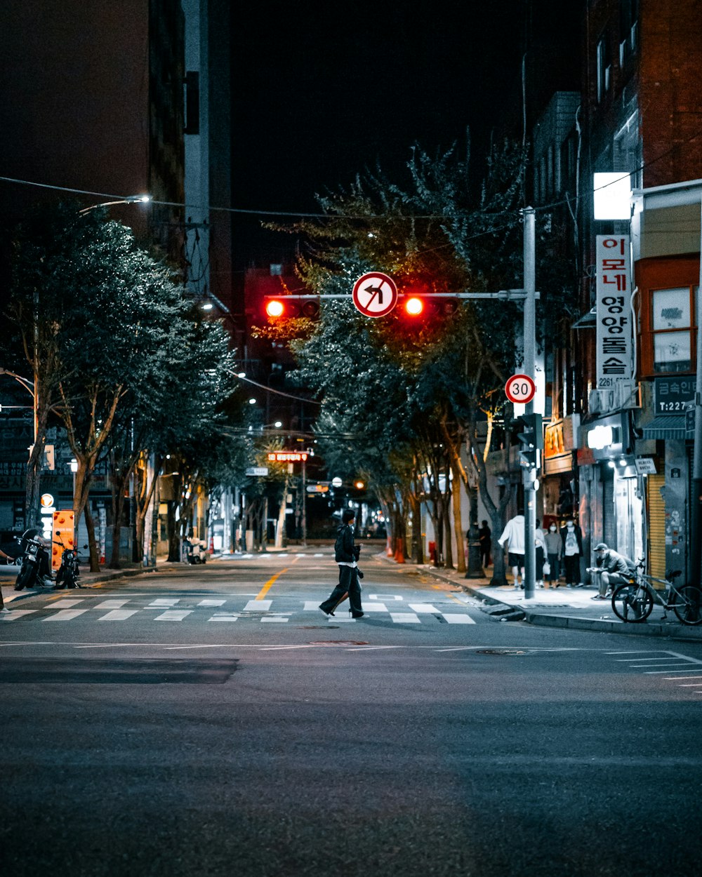 a person walks across a crosswalk