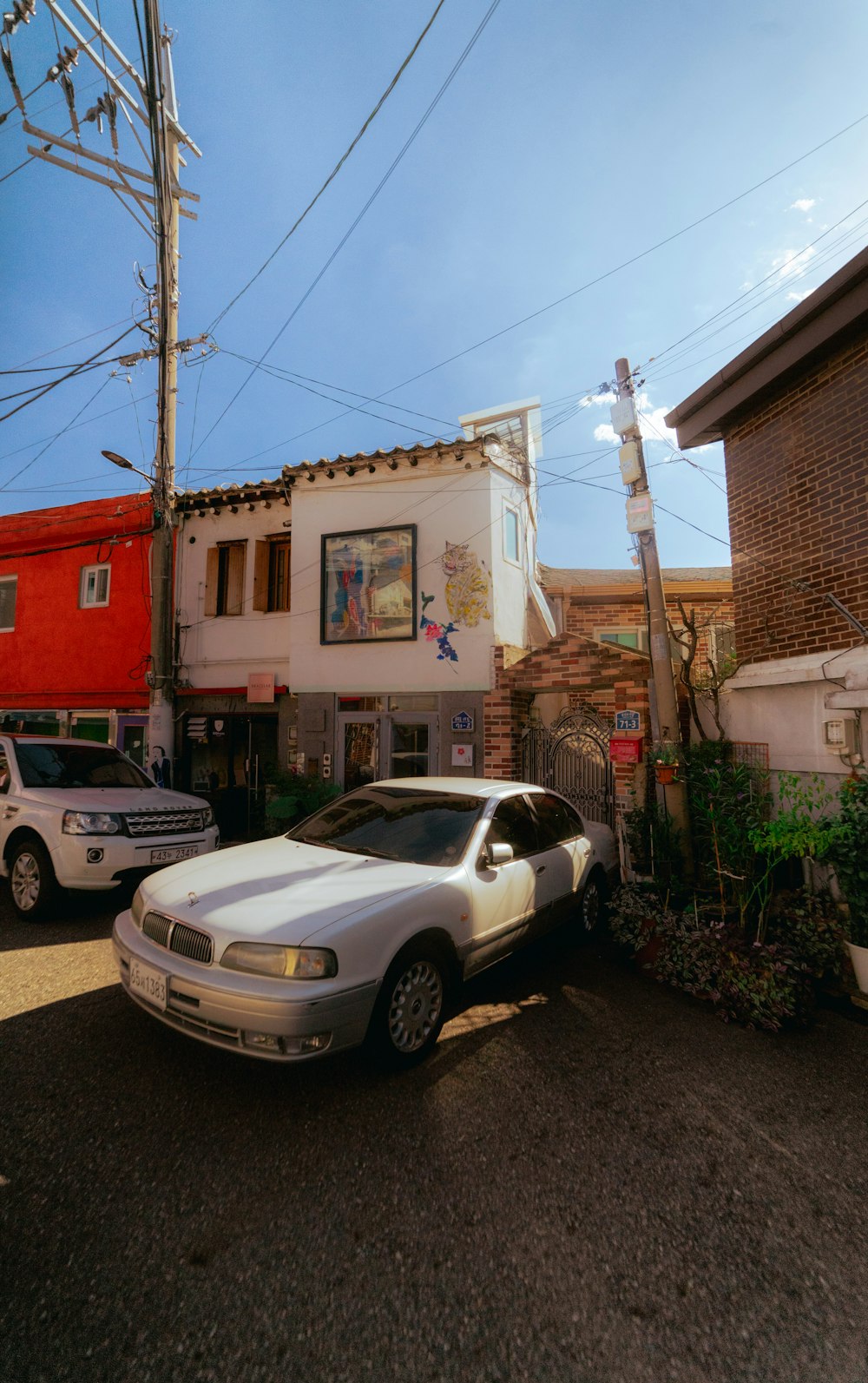 a white car parked on a street