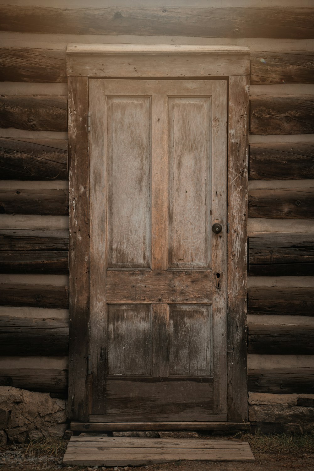 a wooden door in a wooden building