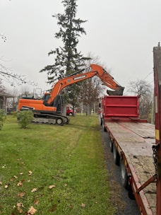 a large yellow machine with a red crane
