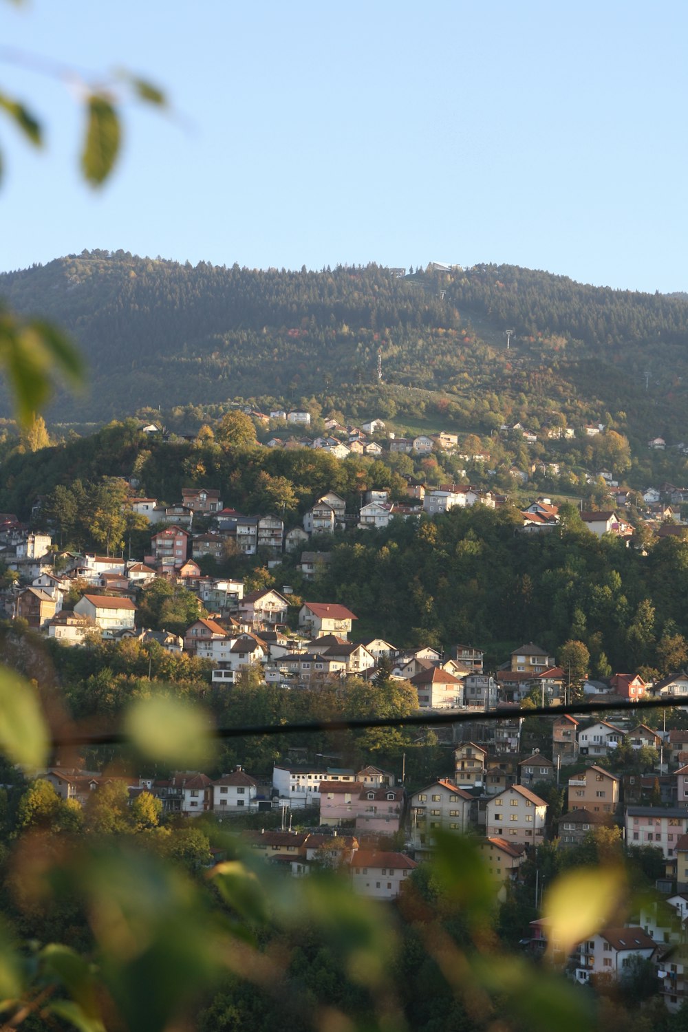 a town with trees and hills