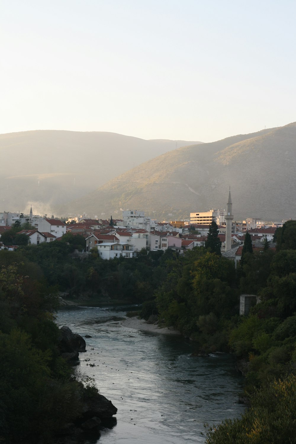 a river with a city in the background