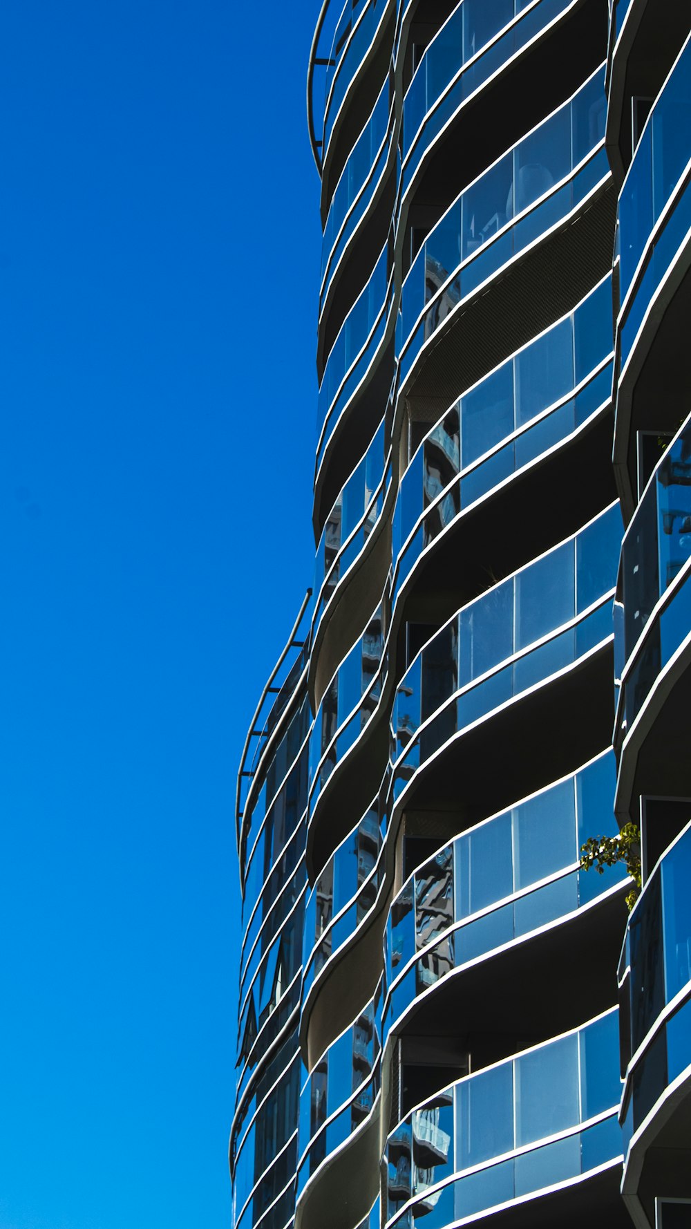 a tall building with glass windows