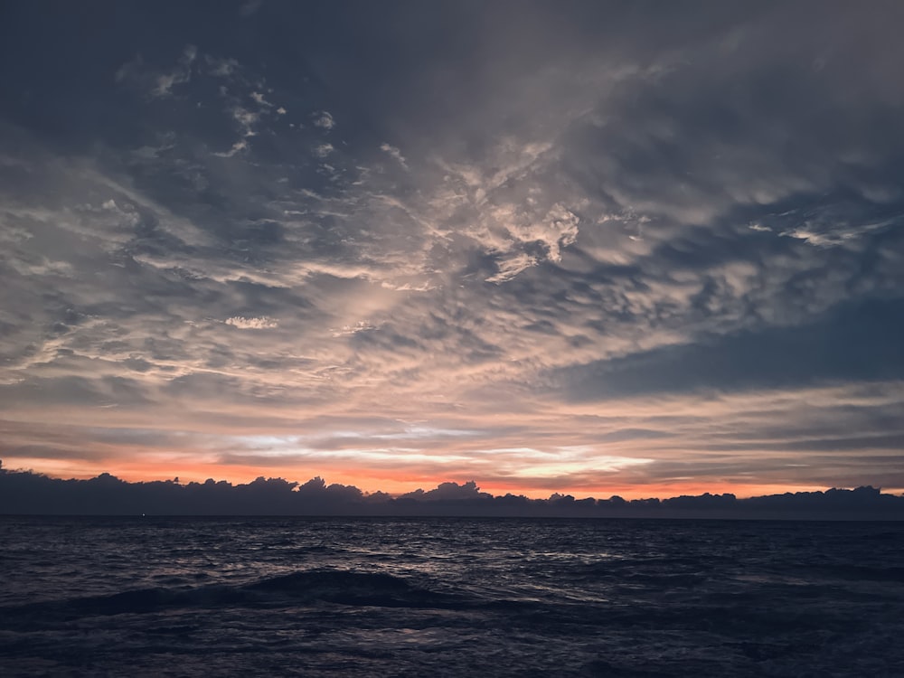 a sunset over a body of water