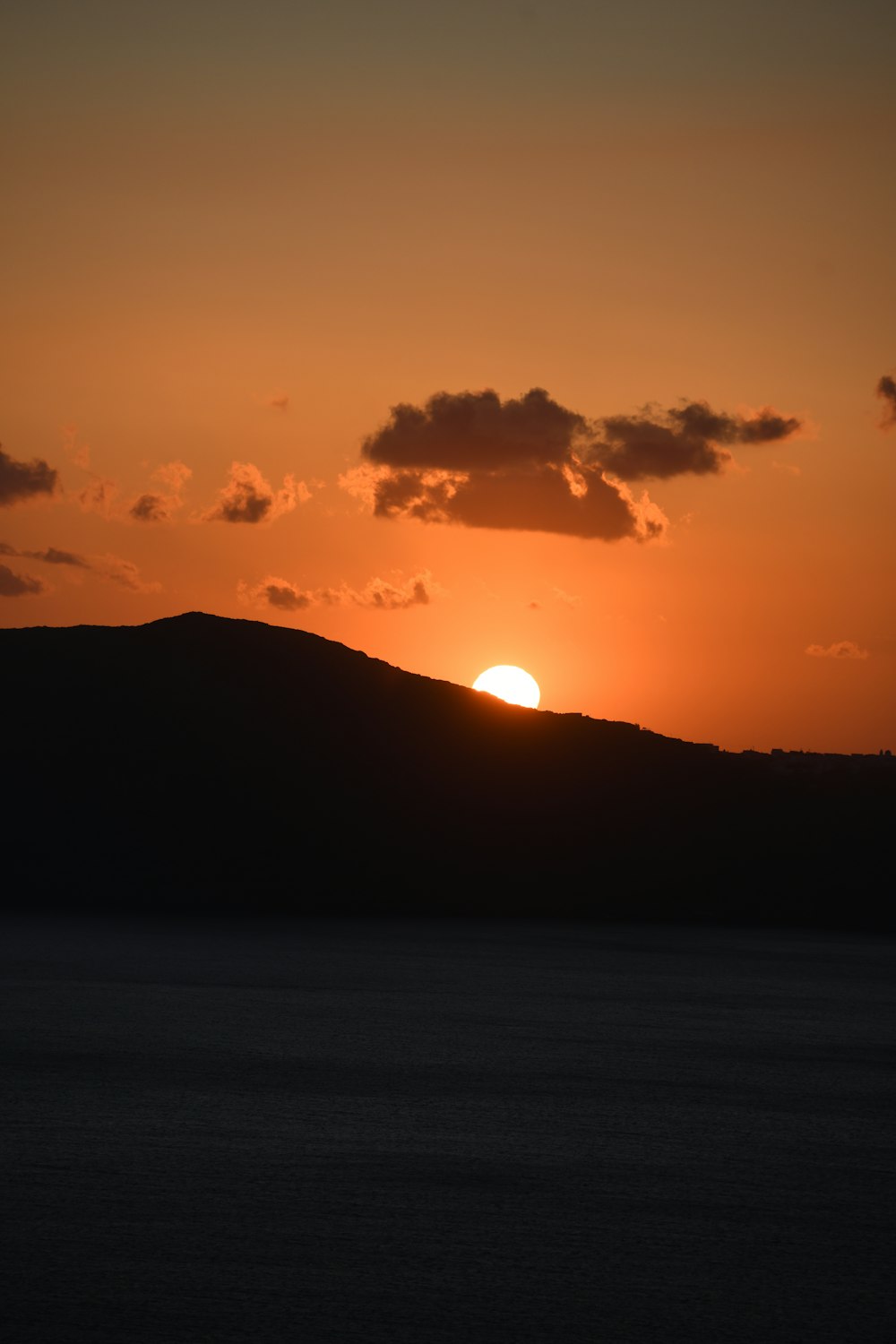 a sunset over a body of water