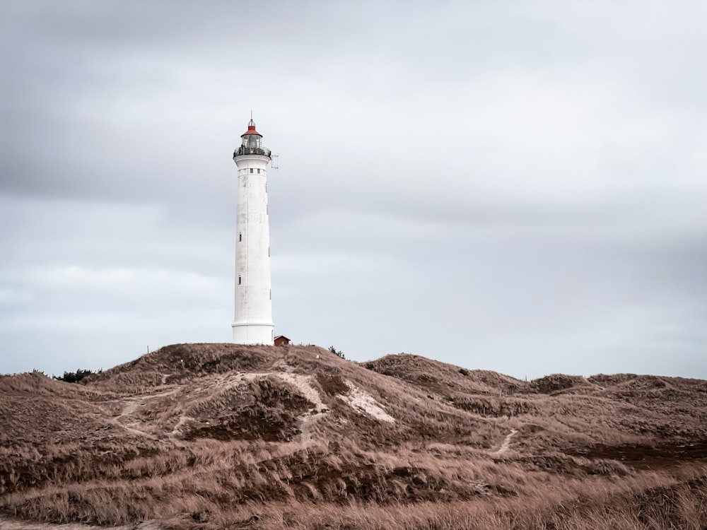 a lighthouse on a hill