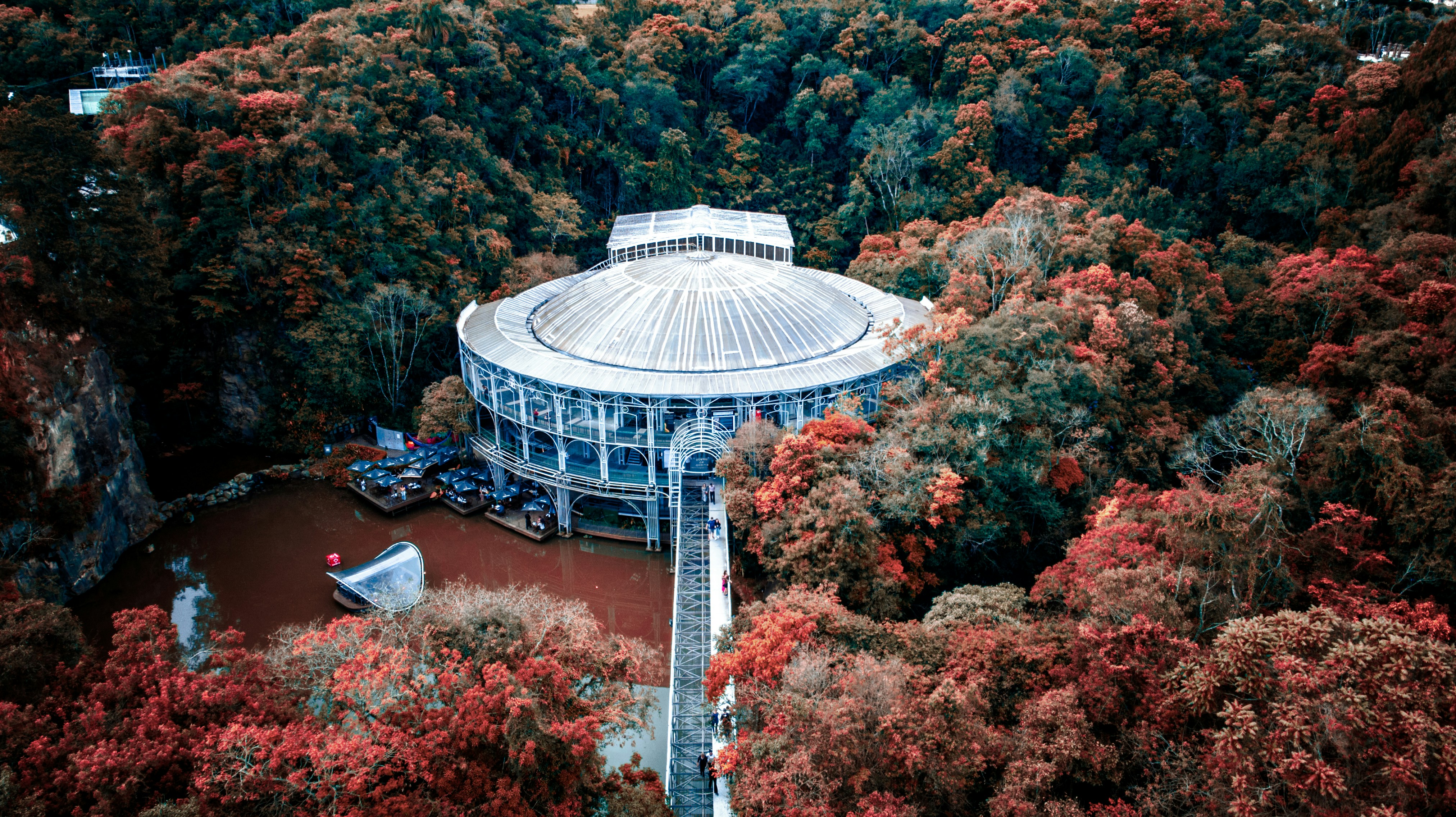 a building with a dome on top surrounded by trees