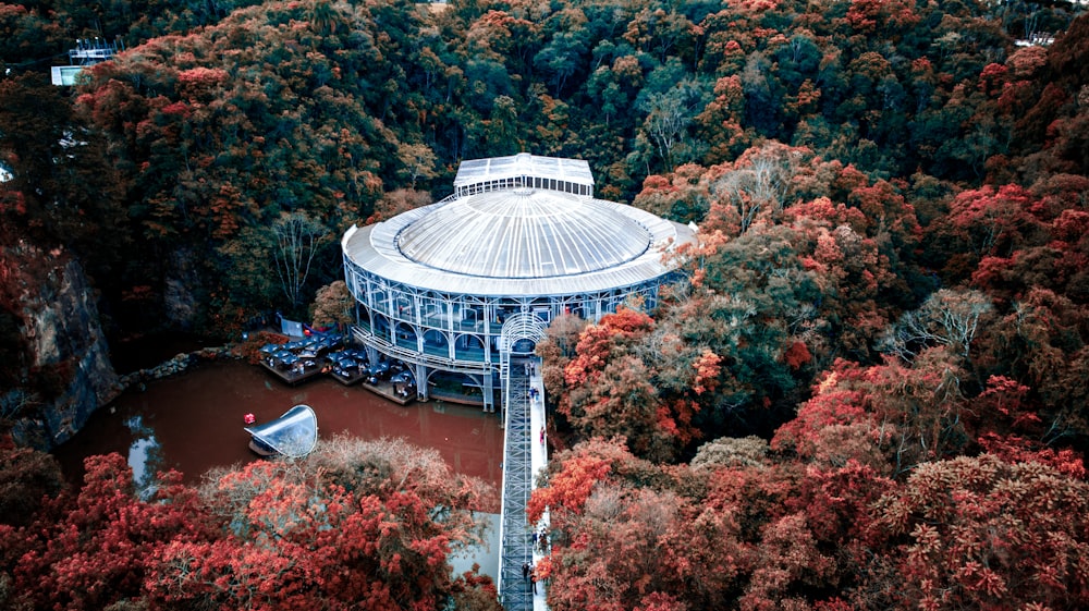 a building with a dome on top surrounded by trees