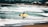 a man carrying a surfboard on a beach
