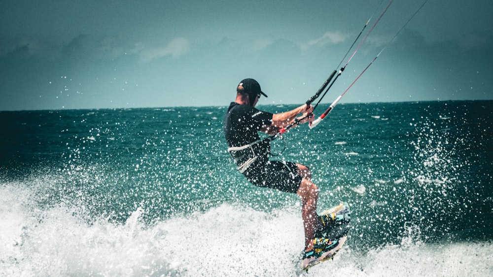 a man kite surfing on the sea