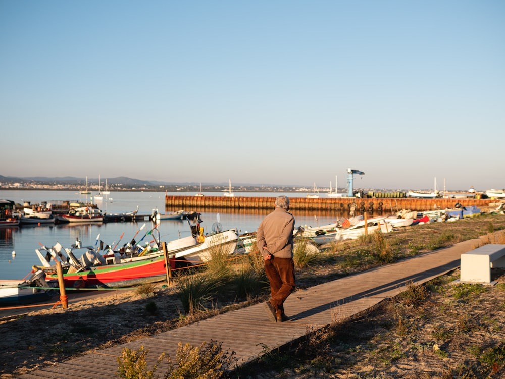 a man walking on a dock