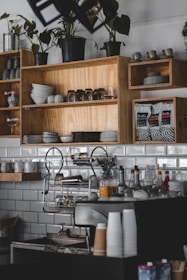 a kitchen with a shelf full of dishes