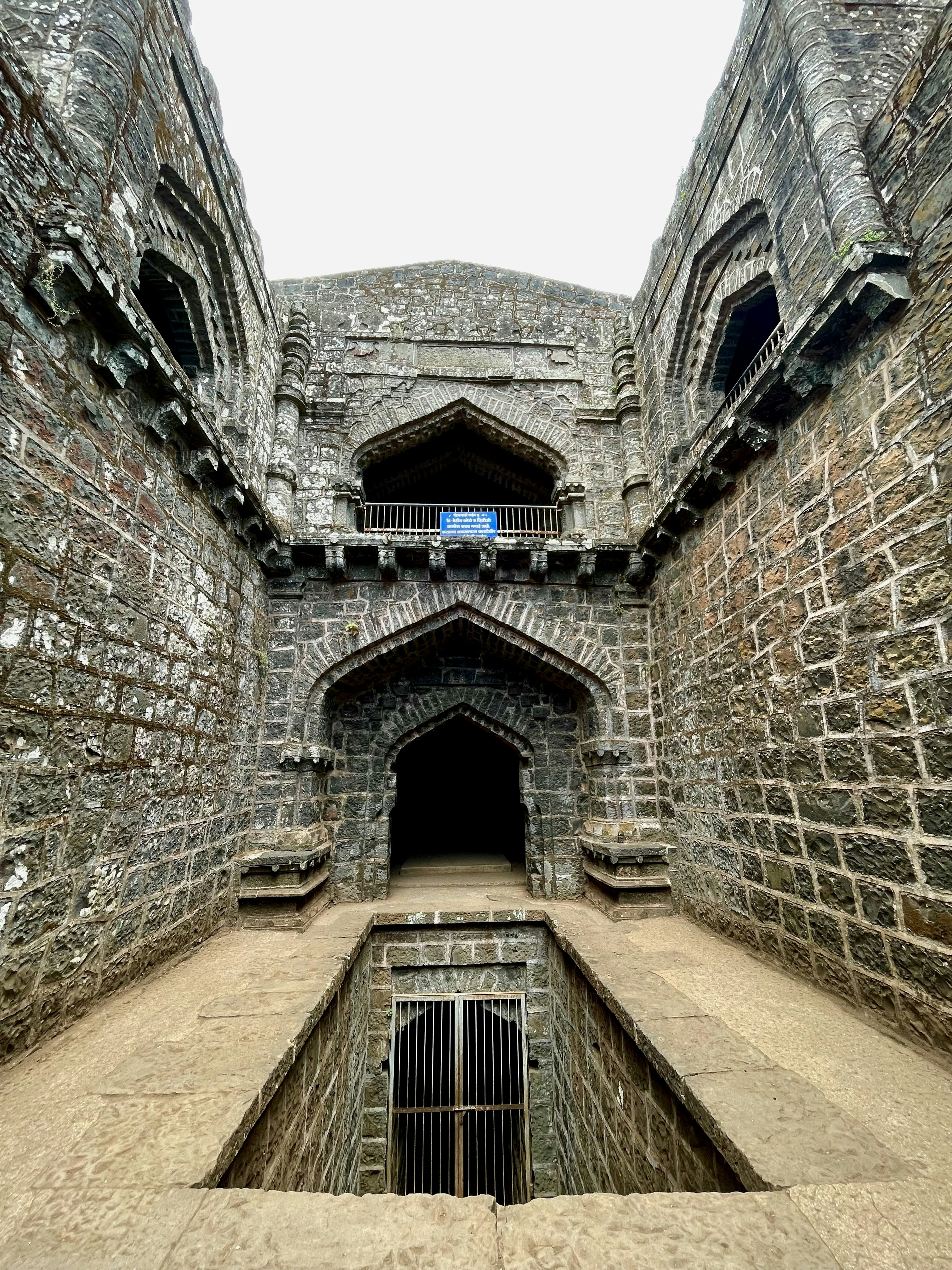 a stone building with a balcony