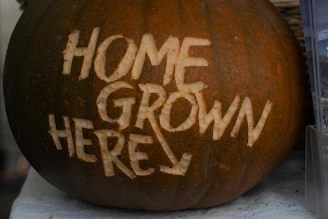 a brown circular object with writing on it