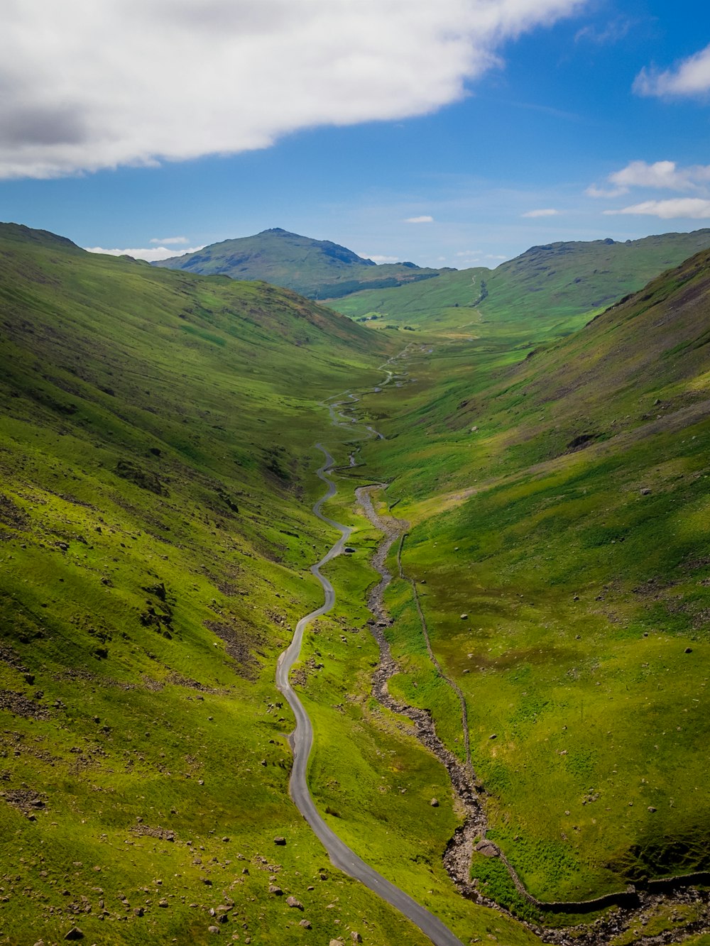 a winding road through a valley
