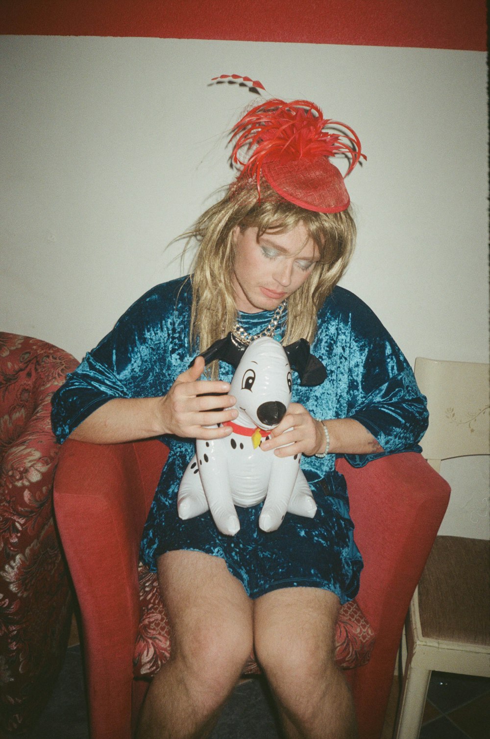 a woman holding a stuffed animal