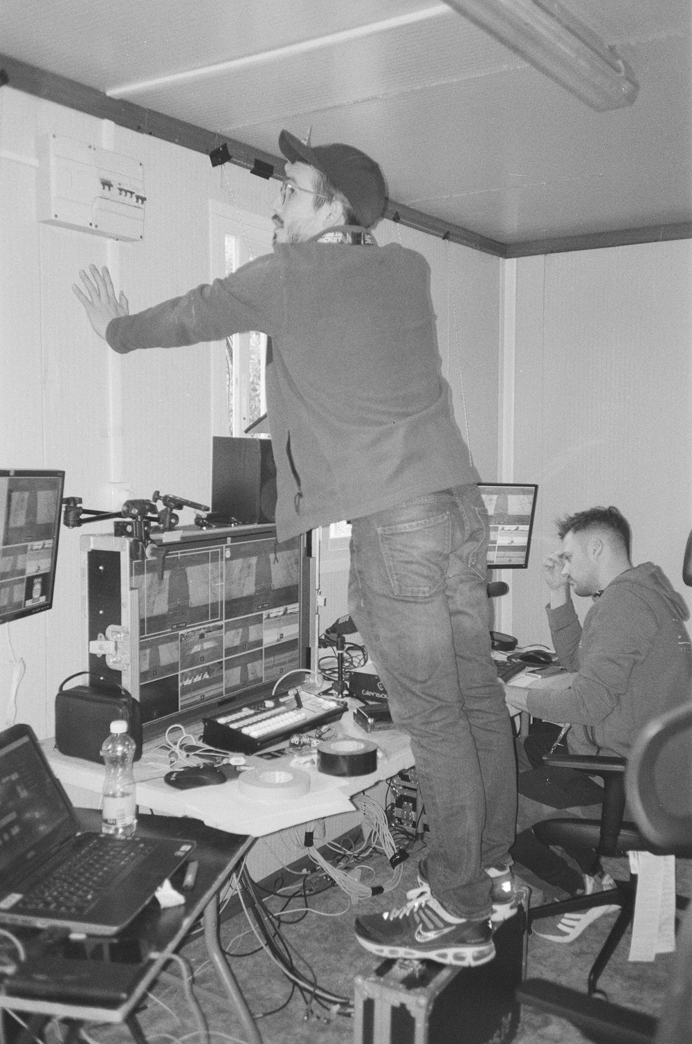 a man standing in front of a computer