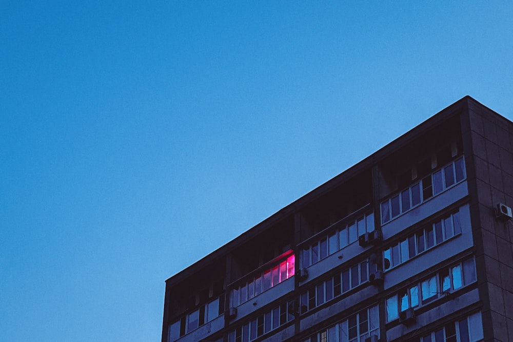 a building with windows and a blue sky