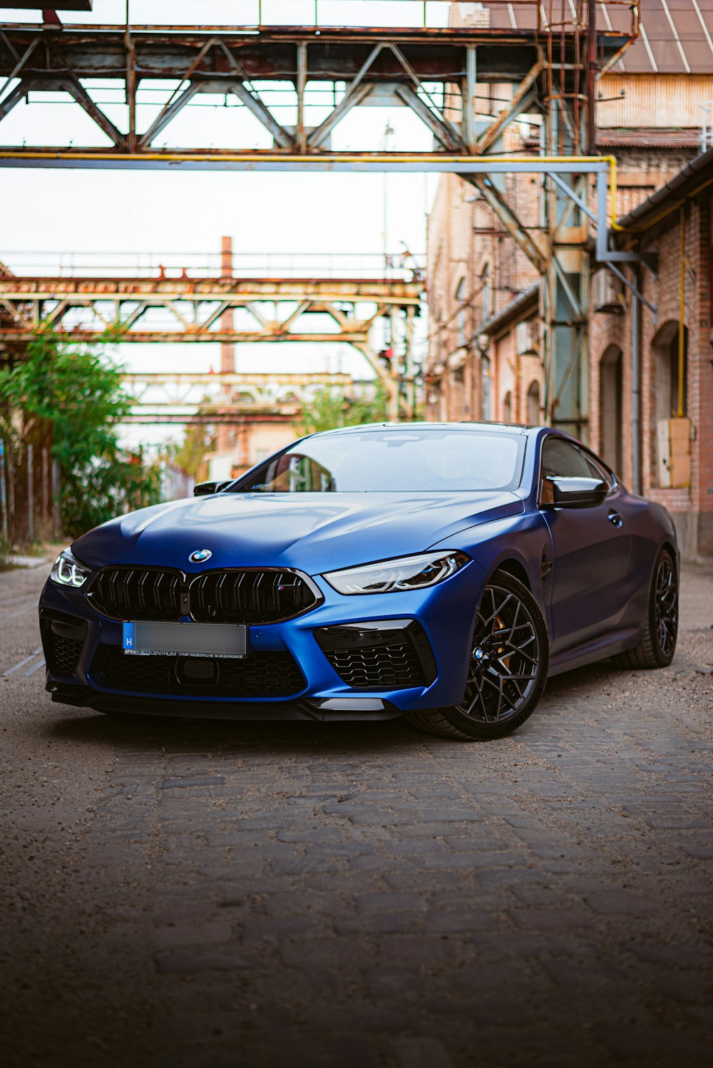 a blue car parked on a street