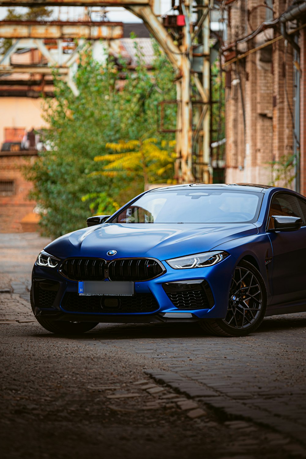 a blue car parked on a street