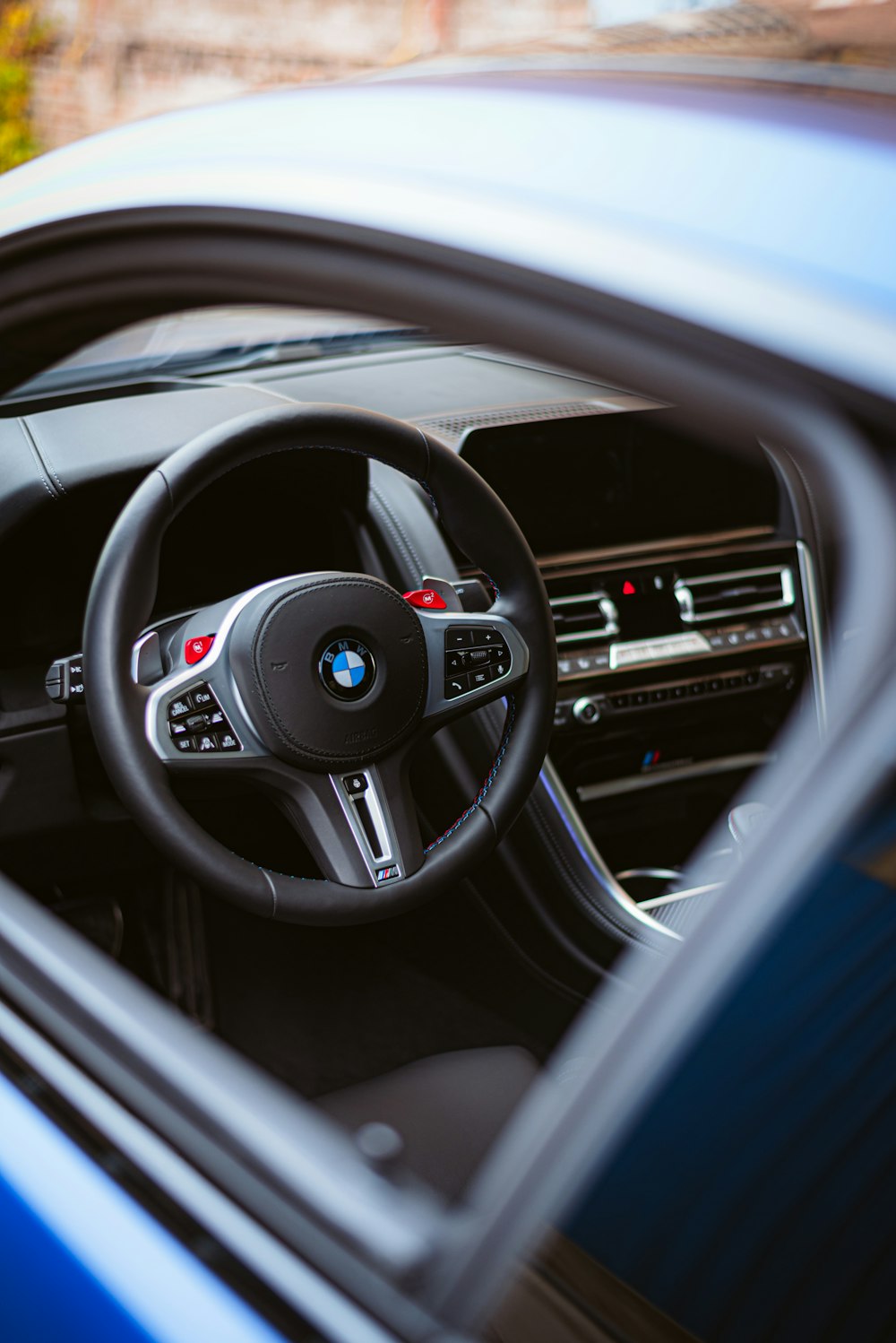 the steering wheel and dashboard of a car